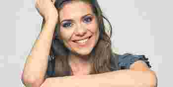 smiling woman holding blank business sign board. studio portrait of beautiful girl. isolated portrait.